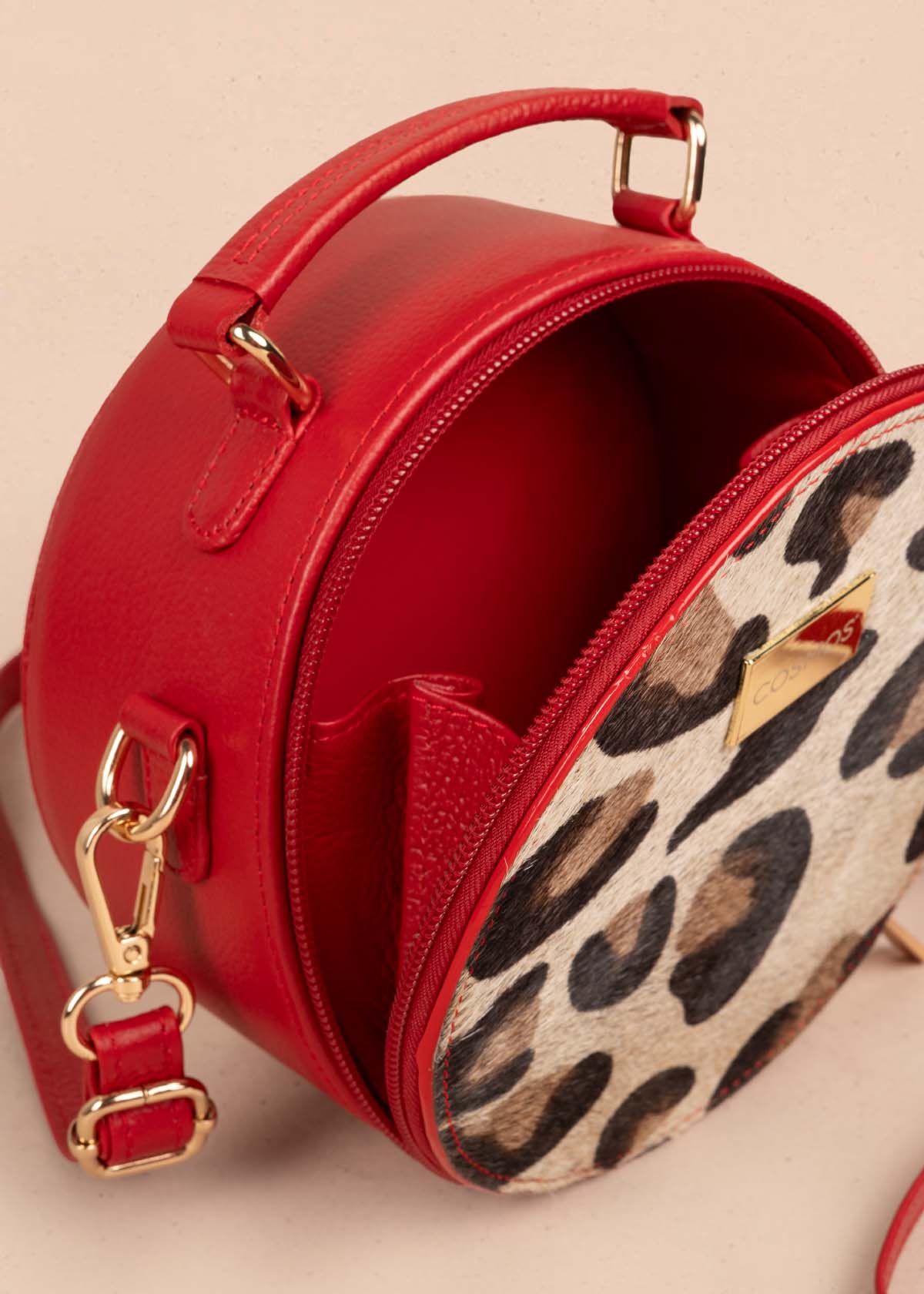 Bolso tipo bandolera en cuero color rojo y cuero con pelo animal print 105312