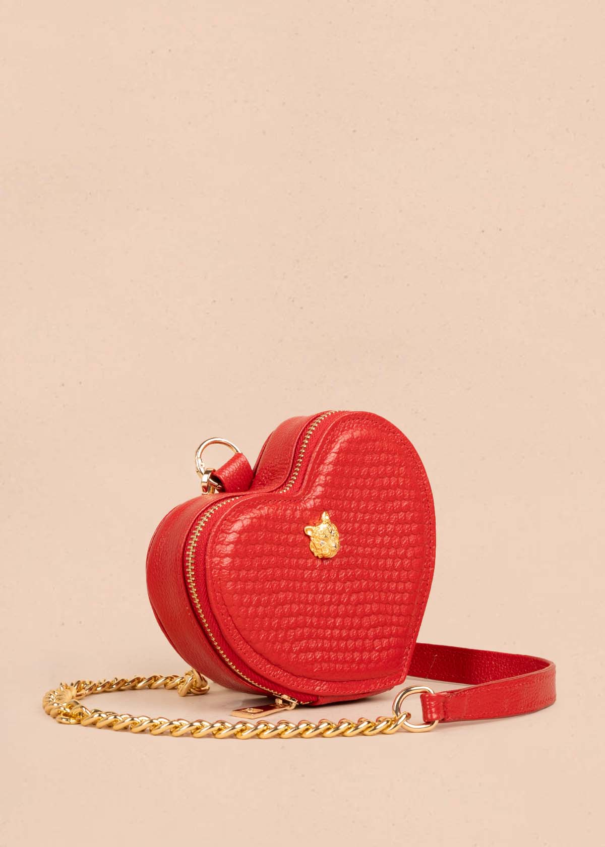 Bolso manos libres en cuero con forma de corazón color rojo 105560
