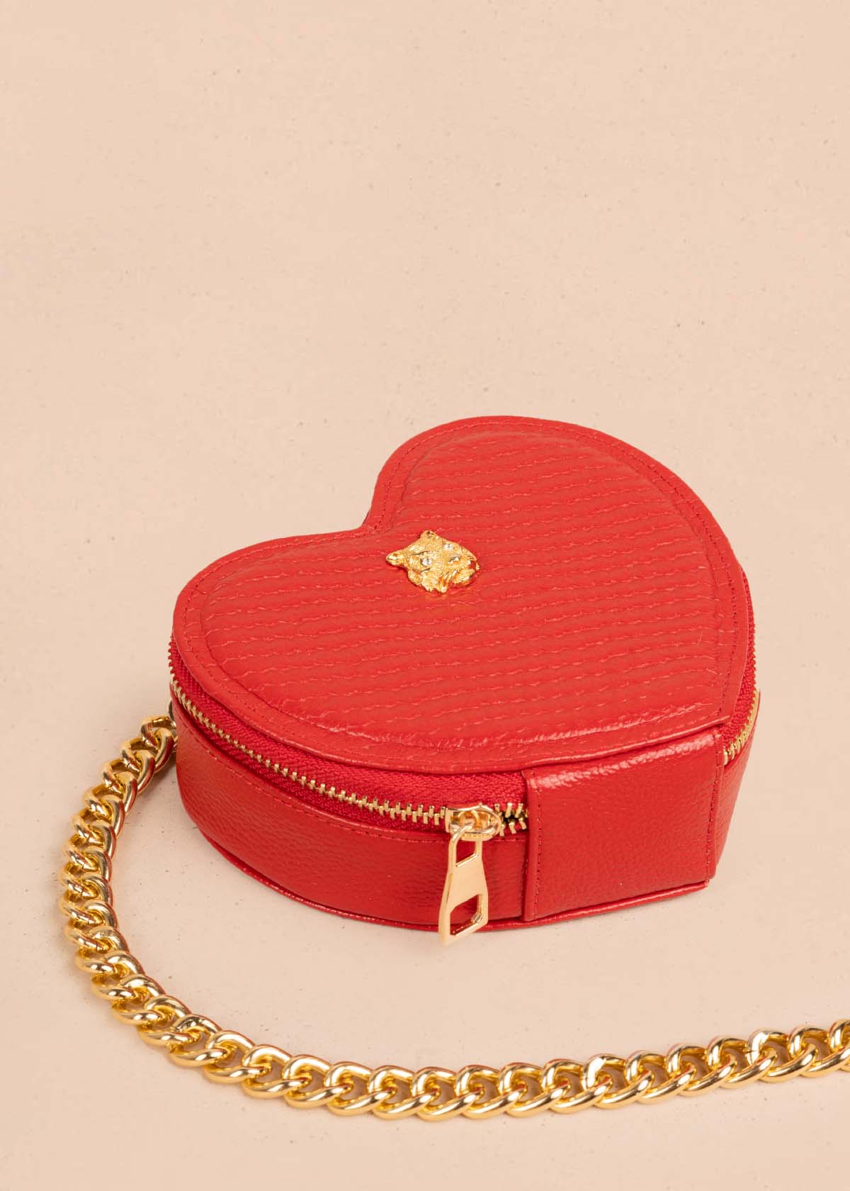 Bolso manos libres en cuero con forma de corazón color rojo 105560