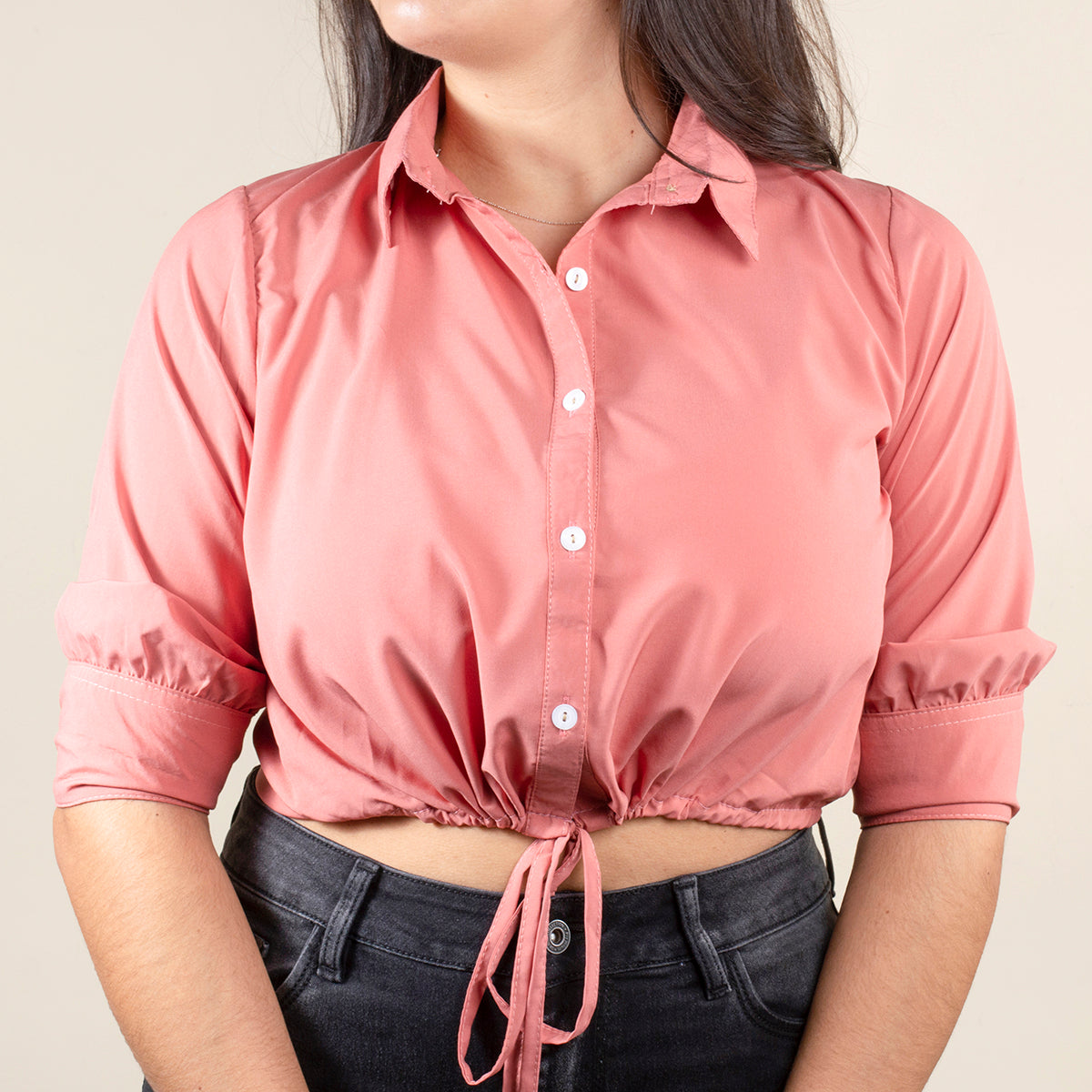 Blusa corta color palo de rosa con moño en abdomen
