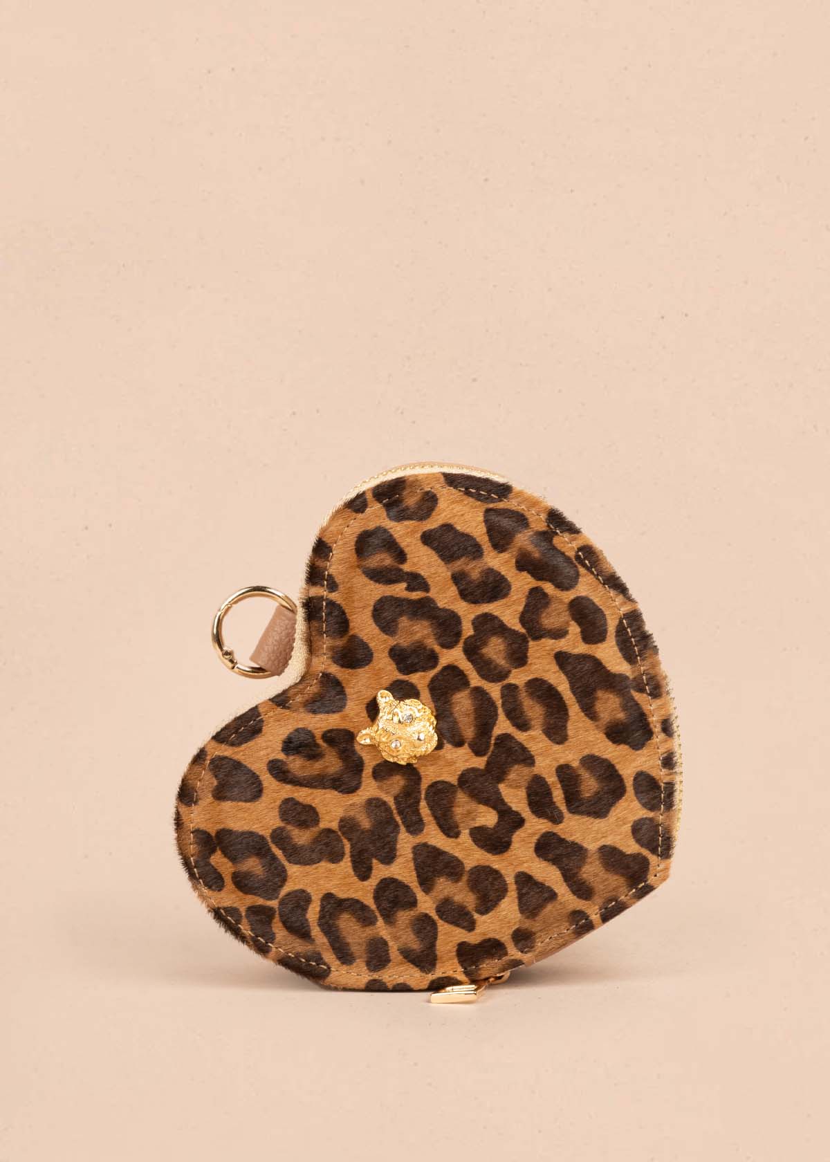 Bolso manos libres en cuero con forma de corazón color animal print 105559