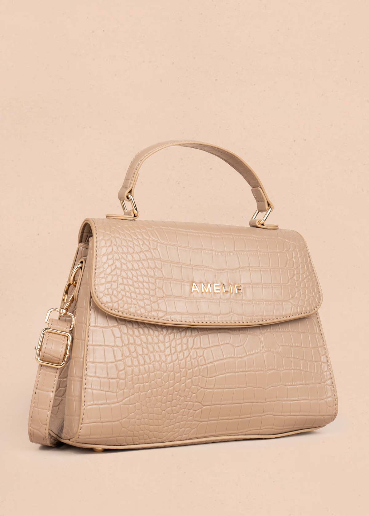 Bolso manos libres color taupe con textura croco 105772