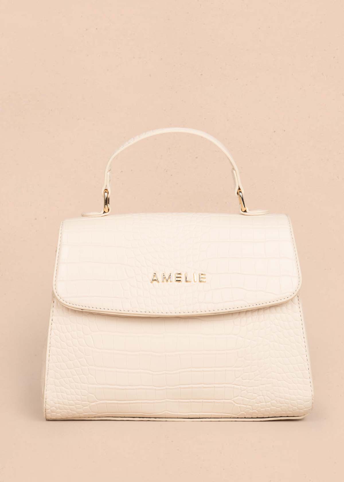 Bolso manos libres color crema con textura croco 105772