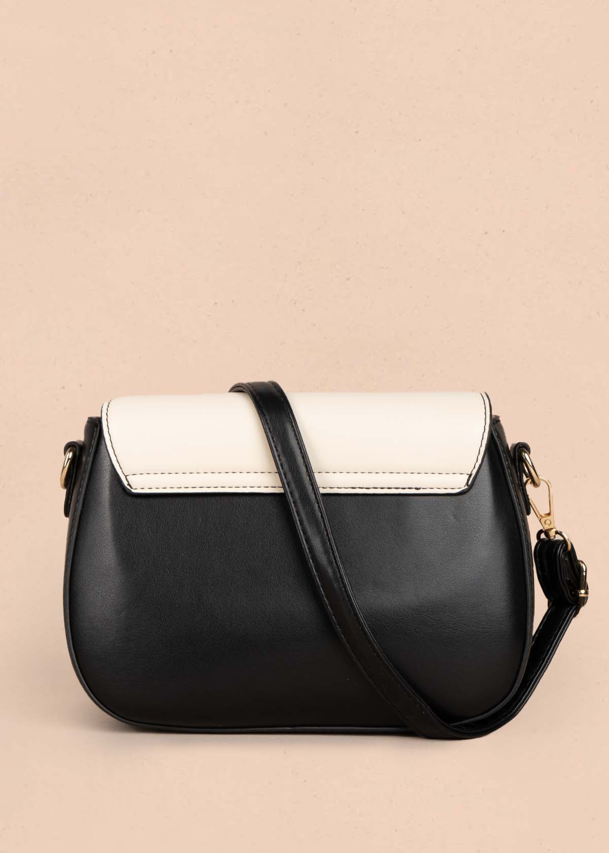 Bolso manos libres color negro con bordado 105778