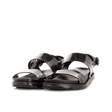 Sandalias color negro, estilo en plástico con hebilla de mujer