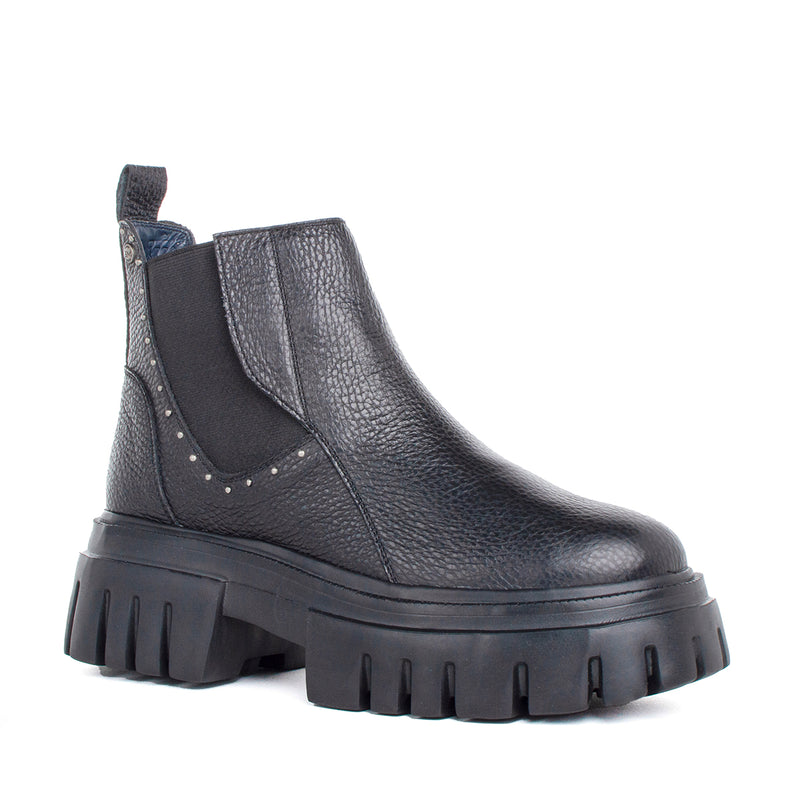Botin suela tractorada color negro, para dama